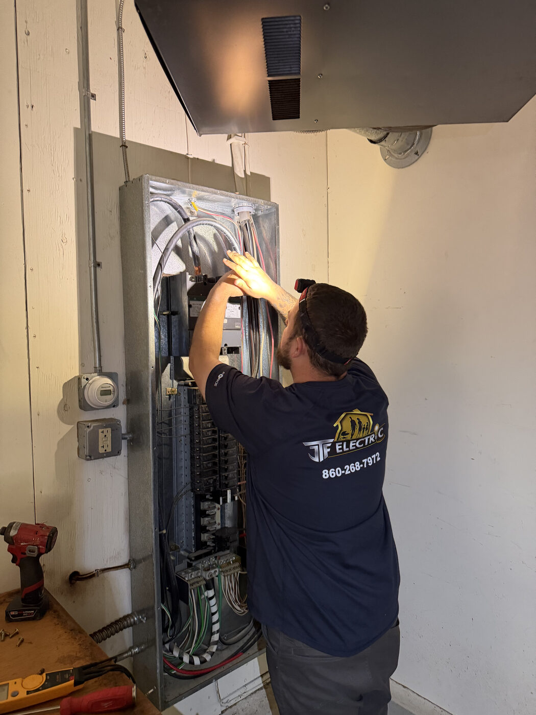 TJF electrician on ladder Willington CT